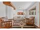 Bright living room featuring a cozy seating arrangement, wood-look floors and neutral walls at 5230 Whispering Robin Ln, Mount Charleston, NV 89124