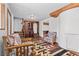 Inviting living room with hardwood floors, charming furnishings, and a cozy fireplace, offering a warm and rustic atmosphere at 5230 Whispering Robin Ln, Mount Charleston, NV 89124