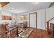 Spacious living room with wood-look floors, large windows and comfortable seating arrangement at 5230 Whispering Robin Ln, Mount Charleston, NV 89124