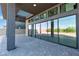 Spacious covered patio featuring sleek sliding glass doors, offering seamless access to the outdoors at 5364 Succulent Rose Dr, Las Vegas, NV 89135