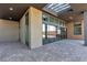 Covered patio with brick flooring and multiple sliding glass doors for seamless indoor-outdoor living at 5364 Succulent Rose Dr, Las Vegas, NV 89135