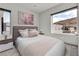 Comfortable bedroom with scenic views, soothing decor, and ample natural light, creating a cozy atmosphere at 5364 Succulent Rose Dr, Las Vegas, NV 89135