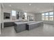 Modern kitchen featuring a large island, sleek cabinetry, and stainless steel appliances at 5364 Succulent Rose Dr, Las Vegas, NV 89135