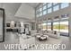 Spacious living room with high ceilings, large windows, and an open floor plan to the kitchen at 5364 Succulent Rose Dr, Las Vegas, NV 89135