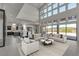 Spacious living room featuring high ceilings, a wall of windows, and modern furnishings at 5364 Succulent Rose Dr, Las Vegas, NV 89135