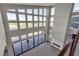 Bright living room boasting high ceilings, large windows, and a cozy fireplace, offering stunning views and natural light at 5364 Succulent Rose Dr, Las Vegas, NV 89135
