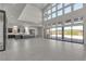 Spacious living room with high ceilings, large windows, and an open floor plan to the kitchen at 5364 Succulent Rose Dr, Las Vegas, NV 89135