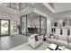 Living space featuring an enclosed office area, open kitchen, and modern design at 5364 Succulent Rose Dr, Las Vegas, NV 89135