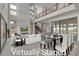 A spacious living area with soaring ceilings, modern decor, and a seamless flow to the dining area at 5364 Succulent Rose Dr, Las Vegas, NV 89135