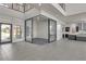 Bright, modern living room featuring a glass-enclosed office and neutral tones at 5364 Succulent Rose Dr, Las Vegas, NV 89135