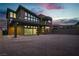 Modern home with a desert landscape and large windows offering views of the surrounding scenery at 5364 Succulent Rose Dr, Las Vegas, NV 89135