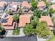 An aerial view showcases a residential neighborhood with orange tile roofs and mature landscaping at 5639 Guiding Star Cir, North Las Vegas, NV 89031