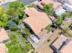 An aerial view of the home with a tile roof, backyard, and surrounding neighborhood at 5639 Guiding Star Cir, North Las Vegas, NV 89031