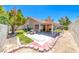 A tranquil backyard featuring a covered patio and garden at 5639 Guiding Star Cir, North Las Vegas, NV 89031