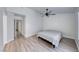 Bedroom featuring wood-look flooring, updated light fixture, neutral paint, and lots of natural light at 5639 Guiding Star Cir, North Las Vegas, NV 89031