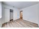 A bedroom with laminate flooring and a closet with sliding doors at 5639 Guiding Star Cir, North Las Vegas, NV 89031