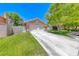 Charming single-story home featuring a two-car garage, well-manicured lawn and mature shade tree at 5639 Guiding Star Cir, North Las Vegas, NV 89031