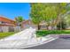 Charming single-story home with a well-manicured lawn, mature tree, and attached two-car garage at 5639 Guiding Star Cir, North Las Vegas, NV 89031