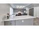 Bright kitchen with modern cabinetry, quartz countertops, and new stainless steel appliances at 5639 Guiding Star Cir, North Las Vegas, NV 89031