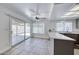 Open kitchen and dining area leading to a patio with sliding glass doors and tile floors at 5639 Guiding Star Cir, North Las Vegas, NV 89031