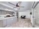 Open-concept living space featuring updated kitchen, neutral paint, tile flooring, and lots of natural light at 5639 Guiding Star Cir, North Las Vegas, NV 89031