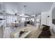 Stylish open-concept living area with tile floors, a modern fireplace, and an eat-in kitchen at 5639 Guiding Star Cir, North Las Vegas, NV 89031