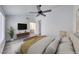 Bright main bedroom featuring vaulted ceilings, an ensuite bathroom, and modern furnishings at 5639 Guiding Star Cir, North Las Vegas, NV 89031