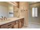 Bathroom featuring double sinks, spacious vanity, and neutral tones at 67 Dow Jones St # 2, Henderson, NV 89074