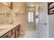 Bathroom featuring double sinks, spacious vanity, and neutral tones at 67 Dow Jones St # 2, Henderson, NV 89074
