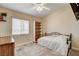 Bedroom featuring neutral tones, a ceiling fan, and a window at 67 Dow Jones St # 2, Henderson, NV 89074
