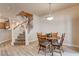 Cozy dining area located next to the staircase and features hardwood flooring at 67 Dow Jones St # 2, Henderson, NV 89074