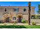 Inviting home exterior with stone accents, a well-manicured lawn, and a charming front entrance at 67 Dow Jones St # 2, Henderson, NV 89074