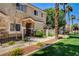 Charming home exterior with a welcoming entrance, beautiful stone accents, and well-kept landscaping at 67 Dow Jones St # 2, Henderson, NV 89074