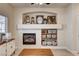 Living room fireplace with decor and storage, plus lots of natural light at 67 Dow Jones St # 2, Henderson, NV 89074