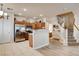 Bright kitchen featuring stainless steel appliances, wood cabinets, and tile flooring open to stairs at 67 Dow Jones St # 2, Henderson, NV 89074