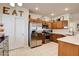 Well-lit kitchen features stainless steel appliances, wooden cabinets, and decorative touches with open layout at 67 Dow Jones St # 2, Henderson, NV 89074