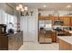 Open kitchen with stainless steel appliances, tile floors, and decorative elements with large window at 67 Dow Jones St # 2, Henderson, NV 89074