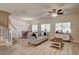Open living space with wood-look floors, a dining area, and plenty of natural light at 67 Dow Jones St # 2, Henderson, NV 89074