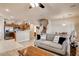 Inviting living room with modern gray-toned decor, tile flooring and an open layout to the kitchen at 67 Dow Jones St # 2, Henderson, NV 89074