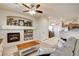 Living space with a fireplace, wood-look floors and a view to the kitchen at 67 Dow Jones St # 2, Henderson, NV 89074