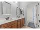 Bathroom features a double sink vanity, framed mirrors, and a separate tub and shower at 7001 Via Locanda Ave, Las Vegas, NV 89131