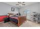 Bedroom boasts a ceiling fan, neutral walls, and French doors overlooking the backyard at 7001 Via Locanda Ave, Las Vegas, NV 89131