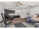 Multipurpose bonus room featuring gym equipment, a drum set, and a convenient kitchenette at 7001 Via Locanda Ave, Las Vegas, NV 89131