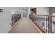 Upper level hallway featuring detailed iron railings and views into the floor below at 7001 Via Locanda Ave, Las Vegas, NV 89131