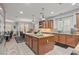 Bright kitchen showcasing a center island, plentiful cabinetry, and stainless steel appliances at 7001 Via Locanda Ave, Las Vegas, NV 89131