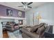 Inviting living room features a cozy fireplace, comfortable leather seating, and tasteful decor at 7001 Via Locanda Ave, Las Vegas, NV 89131