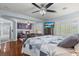 Tranquil main bedroom with a spacious layout, fireplace, and a view to the living area at 7001 Via Locanda Ave, Las Vegas, NV 89131