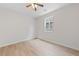 Bedroom with hard wood floors, ceiling fan, and ample natural light at 705 Coastal Lagoon St, Henderson, NV 89002