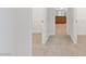 Bedroom hallway with a glimpse of the bathroom and walk-in closets at 705 Coastal Lagoon St, Henderson, NV 89002