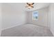 Cozy bedroom with plush carpeting, a ceiling fan, and natural light at 705 Coastal Lagoon St, Henderson, NV 89002
